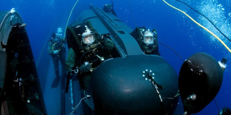 Navy SEALs operating an SDV